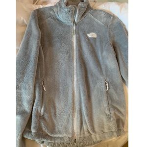 grey fuzzy north face jacket